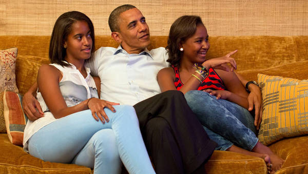 U.S. President Barack Obama and daughters Malia and Sasha, watch on television as first lady Michelle Obama takes the stage to deliver her speech at the Democratic National Convention, in the Treaty Room of the White House in Washington