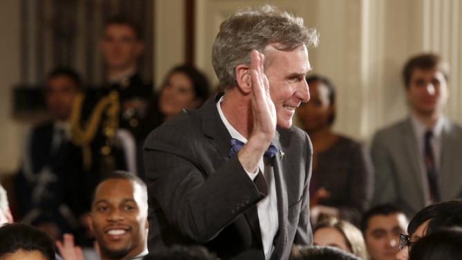Nye acknowledges applause as Obama mentions him in his remarks at the 2015 White House Science Fair at the White House in Washington