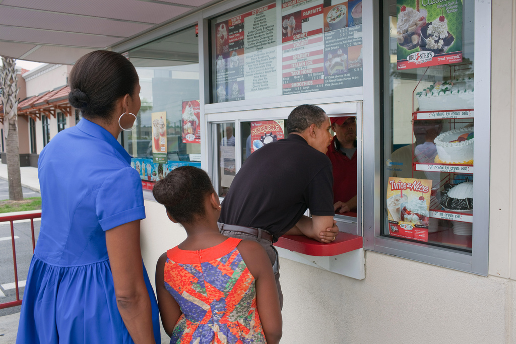 President Barack Obama, First Lady Michelle Obama, and daughter Sasha order ice cream at Bruster's in Panama City Beach, Fla., Aug. 15, 2010 (Official White House Photo by Pete Souza) This official White House photograph is being made available only for publication by news organizations and/or for personal use printing by the subject(s) of the photograph. The photograph may not be manipulated in any way and may not be used in commercial or political materials, advertisements, emails, products, promotions that in any way suggests approval or endorsement of the President, the First Family, or the White House.