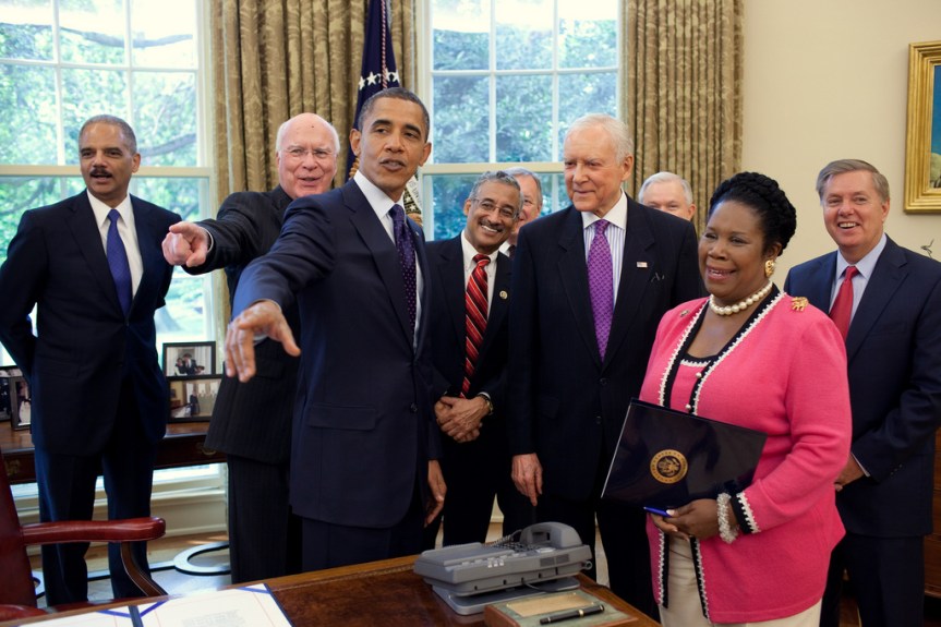President Barack Obama talks with Members of Congress after signing the Fair Sentencing Act in the Oval Office, Aug. 3, 2010. Participants include: Attorney General Eric Holder, Sen. Patrick Leahy, D-Vt., Rep. Bobby Scott, D-Va., Senate Majority Whip Richard Durbin, of Ill., Sen. Jeff Sessions, R-Ala., Sen. Orrin Hatch, R-Utah, Rep. Sheila Jackson-Lee, D-Texas, and Sen. Lindsey Graham, R-SC. (Official White House Photo by Pete Souza) This official White House photograph is being made available only for publication by news organizations and/or for personal use printing by the subject(s) of the photograph. The photograph may not be manipulated in any way and may not be used in commercial or political materials, advertisements, emails, products, promotions that in any way suggests approval or endorsement of the President, the First Family, or the White House.