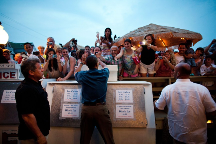 President Barack Obama greets people at Nancy's restaurant in Oak Bluffs, Mass., Aug. 21, 2011. (Official White House Photo by Pete Souza) This official White House photograph is being made available only for publication by news organizations and/or for personal use printing by the subject(s) of the photograph. The photograph may not be manipulated in any way and may not be used in commercial or political materials, advertisements, emails, products, promotions that in any way suggests approval or endorsement of the President, the First Family, or the White House.