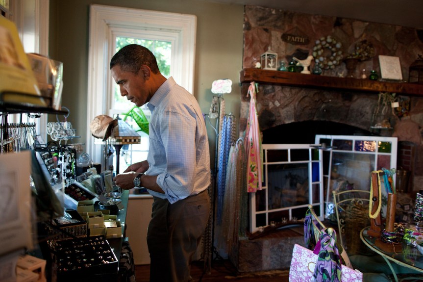 President Barack Obama browses crafts and antiques at Grasshoppers store in LeClaire, Iowa, Aug. 16, 2011, during a three-day bus tour in the Midwest. (Official White House Photo by Pete Souza) This official White House photograph is being made available only for publication by news organizations and/or for personal use printing by the subject(s) of the photograph. The photograph may not be manipulated in any way and may not be used in commercial or political materials, advertisements, emails, products, promotions that in any way suggests approval or endorsement of the President, the First Family, or the White House.