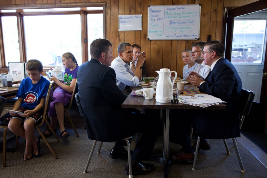President Barack Obama has breakfast with small business owners at RauschÕs Cafe in Guttenberg, Iowa, during a three-day bus tour in the Midwest, Aug.16, 2011. (Official White House Photo by Pete Souza) This official White House photograph is being made available only for publication by news organizations and/or for personal use printing by the subject(s) of the photograph. The photograph may not be manipulated in any way and may not be used in commercial or political materials, advertisements, emails, products, promotions that in any way suggests approval or endorsement of the President, the First Family, or the White House.