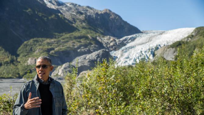 President Barack Obama speaks to members of the media while on a hike to the Exit Glacier in Seward, Alaska, Tuesday, Sept. 1, 2015, which according to National Park Service research, has retreated approximately 1.25 miles over the past 200 years. Obama is on a historic three-day trip to Alaska aimed at showing solidarity with a state often overlooked by Washington, while using its glorious but changing landscape as an urgent call to action on climate change. (AP Photo/Andrew Harnik)