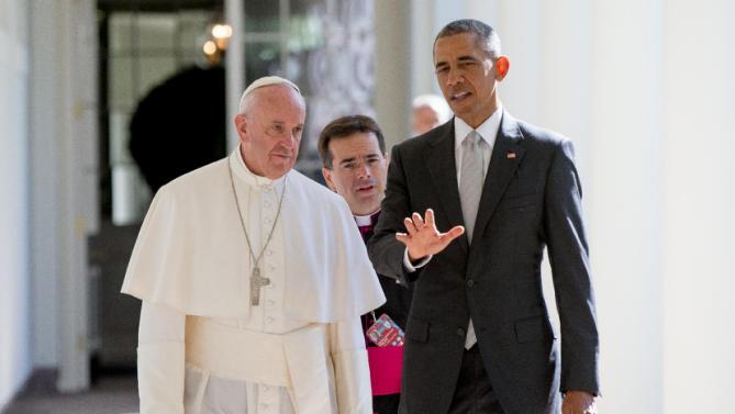President Barack Obama and Pope Francis, accompanied by Msgr. Mark Miles, the English translator for the Pontiff, walk down the Colonnade before meeting in the Oval Office of the White House in Washington, Wednesday, Sept. 23, 2015. (AP Photo/Andrew Harnik)