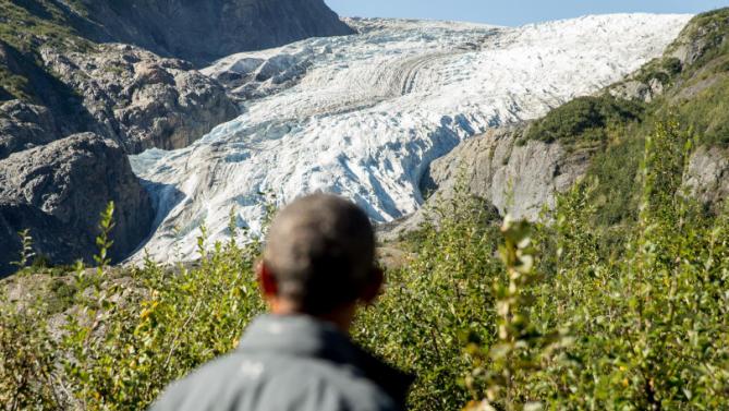 President Barack Obama pauses to view the Exit Glacier in Seward, Alaska, Tuesday, Sept. 1, 2015, which according to National Park Service research, has retreated approximately 1.25 miles over the past 200 years. Obama is on a historic three-day trip to Alaska aimed at showing solidarity with a state often overlooked by Washington, while using its glorious but changing landscape as an urgent call to action on climate change. (AP Photo/Andrew Harnik)