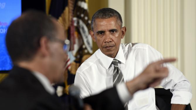 President Barack Obama, right, listens as Labor Secretary Thomas Perez, left, speaks the White House Summit on Worker Voice in the East Room of the White House in Washington, Wednesday, Oct. 7, 2015. Participants included workers, employers, unions, organizers and other advocates and experts on how to energize a new generation of Americans to come together and recognize the potential power of their voice at work. (AP Photo/Susan Walsh)