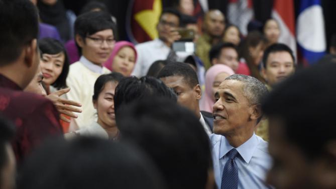 President Barack Obama shakes hands with audience members after speaking at the Young Southeast Asian Leaders Initiative (YSEALI) town hall at Taylor's University in Kuala Lumpur, Malaysia, Friday, Nov. 20, 2015. (AP Photo/Susan Walsh)