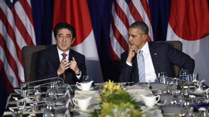 U.S. President Barack Obama, right, listens as Japans Prime Minister Shinzo Abe, left, talks during a bilateral meeting at the Asia-Pacific Economic Cooperation summit in Manila, Philippines, Thursday, Nov. 19, 2015. (AP Photo/Susan Walsh)