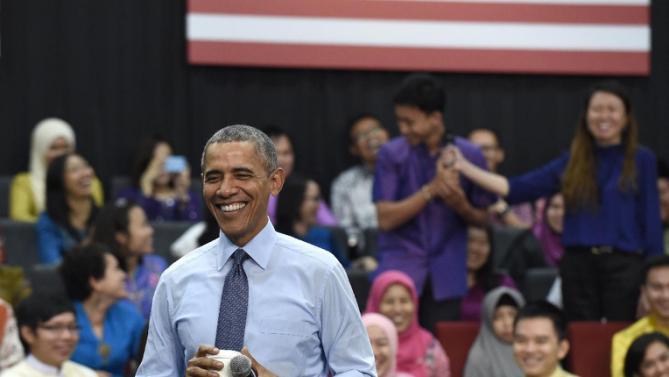 President Barack Obama laughs as he was called "old" as he was asked a question, by the man center in purple, during the Young Southeast Asian Leaders Initiative (YSEALI) town hall at Taylor's University in Kuala Lumpur, Malaysia, Friday, Nov. 20, 2015. (AP Photo/Susan Walsh)