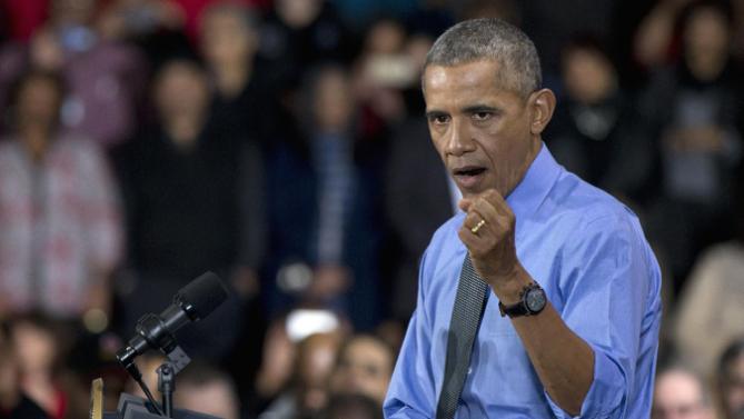 President Barack Obama gestures as he speaks at the UAW-GM Center for Human Resources in Detroit, Wednesday, Jan. 20, 2016, to highlight the progress made by the city, its people and neighborhoods, and the American auto industry. (AP Photo/Carolyn Kaster)