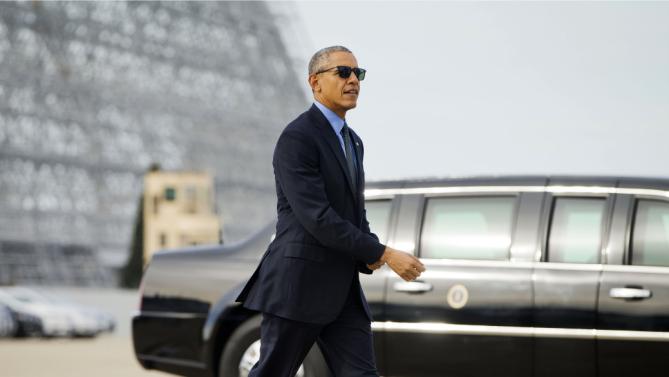 President Barack Obama walks across the tarmac after greeting guests before boarding Air Force One at Moffett Federal Airfield in Mountain View, Calif., Thursday, Feb. 11, 2016. Obama is traveling to Los Angeles to tape an appearance on the Ellen DeGeneres Show and attend a pair of private Democratic fund raisers. (AP Photo/Pablo Martinez Monsivais)