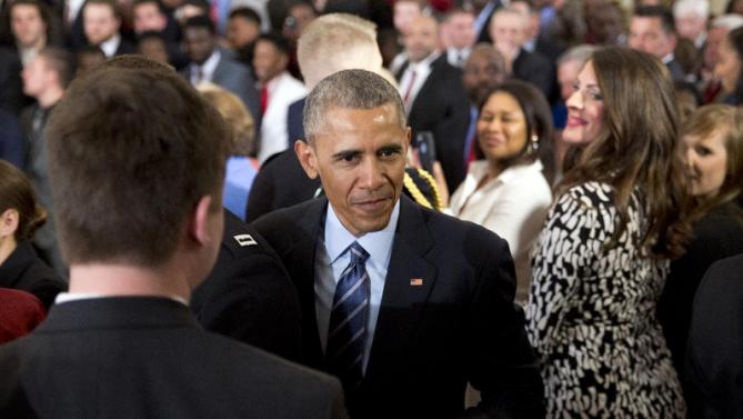 President Barack Obama walks though the audience after a ceremony to honor the 2015-2016 College Football Playoff National Champion Alabama Crimson Tide in the East Room of the White House, in Washington, Wednesday, March 2, 2016. (AP Photo/Carolyn Kaster)