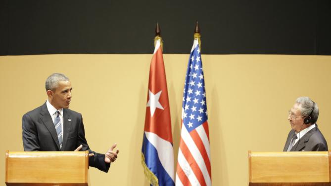U.S. President Barack Obama, left, speaks next to Cuba's President Raul Castro, during a joint statement in Havana, Cuba, Monday, March 21, 2016. President Raul Castro called on President Obama to lift longstanding U.S. restrictions on Cuba, even as he and Obama pledged to move forward with normalizing relations between Cuba and its longtime Cold War-era foe. (AP Photo/Ramon Espinosa)