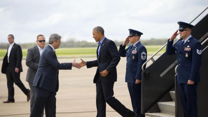 President Barack Obama is greeted by Austin, Texas Mayor Steve Adler on the tarmac upon his arrival on Air Force One, Friday, March 11, 2016, at Austin Bergstrom International Airport in Austin, Texas. Obama traveled to Austin, to speak at South by Southwest Festival (SXSW) and attend 2 Democratic National Committee fundraisers. (AP Photo/Pablo Martinez Monsivais)