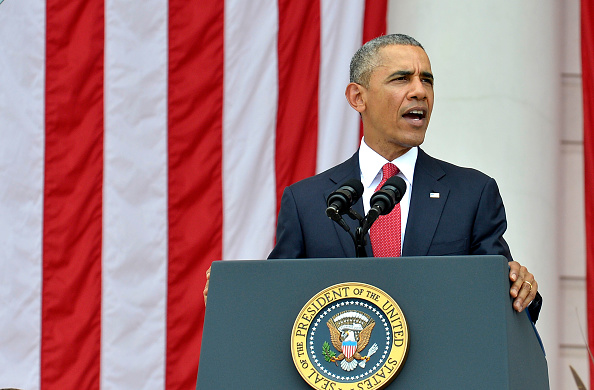 ARLINGTON, VA - MAY 30: (AFP-OUT) President Barack Obama delivers remarks at the Amphitheater after laying a wreath at the Tomb of the Unknown Soldier at Arlington National Cemetery on May 30, 2016 in Arlington, Virginia. Obama paid tribute to the nation's fallen military service members. (Photo by Mike Theiler-Pool/Getty Images)