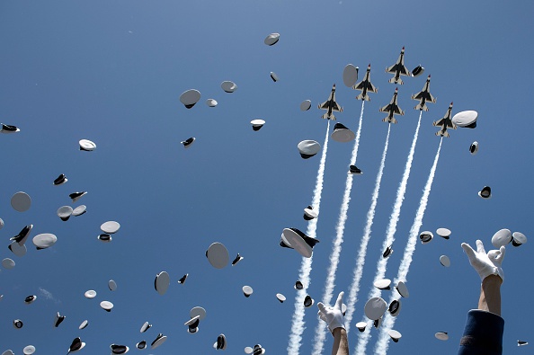 Cadets celebrate after taking their oath during a graduation ceremony at the US Air Force Academy's Falcon Stadium June 2, 2016 in Colorado Springs, Colorado. US President Barack Obama gave the commencement speech at the academy. / AFP / Brendan Smialowski (Photo credit should read BRENDAN SMIALOWSKI/AFP/Getty Images)