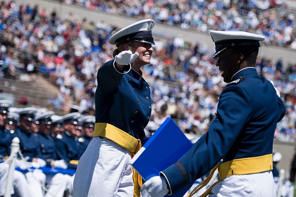 Cadets celebrate during a graduation ceremony at the US Air Force Academy's Falcon Stadium June 2, 2016 in Colorado Springs, Colorado. US President Barack Obama gave the commencement speech at the academy. / AFP / Brendan Smialowski (Photo credit should read BRENDAN SMIALOWSKI/AFP/Getty Images)