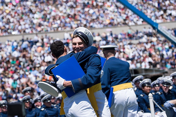 Cadets celebrate during a graduation ceremony at the US Air Force Academy's Falcon Stadium June 2, 2016 in Colorado Springs, Colorado. US President Barack Obama gave the commencement speech at the academy. / AFP / Brendan Smialowski (Photo credit should read BRENDAN SMIALOWSKI/AFP/Getty Images)