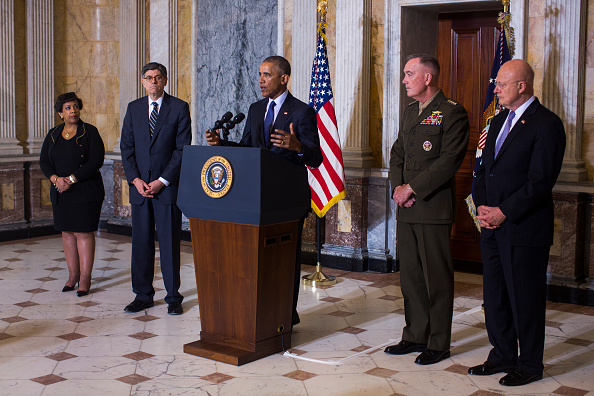 WASHINGTON, DC - JUNE 14: (AFP-OUT)US President Barack Obama (C) speaks on the Orlando shooting at the Treasury Department while Attorney General Loretta Lynch (L), Treasury Secretary Jack Lew (C-L), Chairman of the Joint Chiefs of Staff General Joseph Dunford (C-R) and Director of National Intelligence James Clapper (R) look on, on June 14, 2016 in Washington, DC. Obama directly attacked Donald Trump's proposal to ban Muslims from entering the United States. (Photo by Jim Lo Scalzo-Pool/Getty Images)