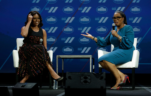 US First lady Michelle Obama (L) and Oprah Winfrey speak at the White House Summit on the United State of Women in Washington, DC on June 14, 2016. / AFP / YURI GRIPAS (Photo credit should read YURI GRIPAS/AFP/Getty Images)