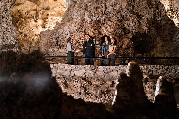 A US Park Ranger gives US President Barack Obama (2L), Sasha Obama (C), first lady Michelle Obama (2R) and Malia Obama a tour of Carlsbad Caverns National Park on June 17, 2016 in Carlsbad, New Mexico. / AFP / Brendan Smialowski (Photo credit should read BRENDAN SMIALOWSKI/AFP/Getty Images)