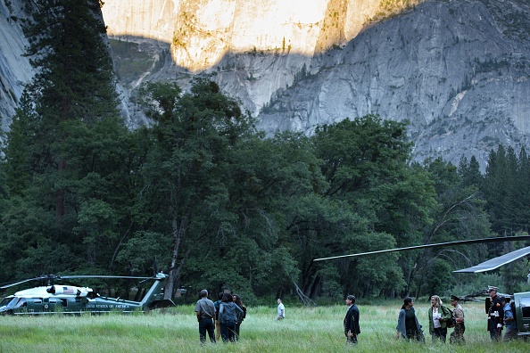 US President Barack Obama and the first family walk through Ahwahnee Meadow June 17, 2016 in Yosemite Vally, California. / AFP / Brendan Smialowski (Photo credit should read BRENDAN SMIALOWSKI/AFP/Getty Images)