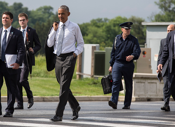 BETHESDA, MD - JUNE 21: (AFP OUT) U.S. President Barack Obama walks to Marine One after visiting wounded service members at Walter Reed National Military Medical Center on June 21, 2016 in Bethesda, MD. (Photo by Joshua Roberts - Pool/Getty Images)