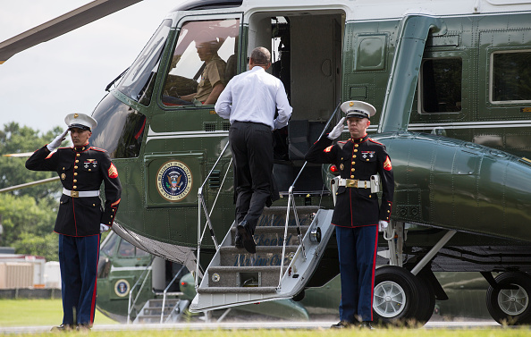 U.S. President Barack Obama boards Marine One after visiting wounded service members at Walter Reed National Military Medical Center in Bethesda, M.D., U.S. on Tuesday, June 21, 2016. Photographer: Joshua Roberts/Bloomberg