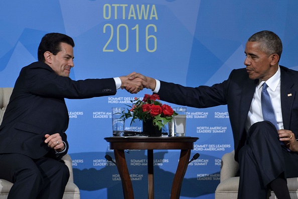 US President Barack Obama(R)and Mexican President Enrique Pena Nieto meet during the North American Leaders Summit at the National Gallery of Canada on June 29, 2016 in Ottawa, Ontario. / AFP / Brendan Smialowski (Photo credit should read BRENDAN SMIALOWSKI/AFP/Getty Images)