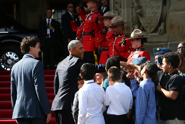 Justin Trudeau, Canada's prime minister, left, and U.S. President Barack Obama, center, greet school children outside of Parliament Hill after the North American Leaders Summit (NALS) in Ottawa, Ontario, Canada, on Wednesday, June 29, 2016. Leaders from the three Nafta nations "agree on the need for governments of all major steel-producing countries to make strong and immediate commitments to address the problem of global excess steelmaking capacity," according to a statement from Trudeau. Photographer: Cole Burston/Bloomberg via Getty Images