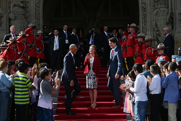 U.S. President Barack Obama, from center left, Sophie Gregoire-Trudeau, and Justin Trudeau, Canada's prime minister, are applauded by school children outside of Parliament Hill after the North American Leaders Summit (NALS) in Ottawa, Ontario, Canada, on Wednesday, June 29, 2016. Leaders from the three Nafta nations "agree on the need for governments of all major steel-producing countries to make strong and immediate commitments to address the problem of global excess steelmaking capacity," according to a statement from Trudeau. Photographer: Cole Burston/Bloomberg via Getty Images