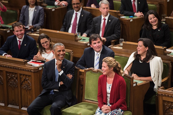US President Barack Obama (L) confers with Sophie Gregoire Trudeau before addressing Parliament in the House of Commons Chamber on Parliament Hill during the North American Leaders Summit on June 29, 2016 in Ottawa, Ontario. / AFP / Brendan Smialowski (Photo credit should read BRENDAN SMIALOWSKI/AFP/Getty Images)