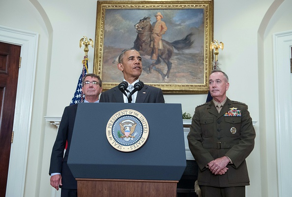 US President Barack Obama delivers a statement on Afghanistan with Defense Secretary Ashton Carter (L) and the Chairman of the Joint Chiefs of Staff Gen. Joseph Dunford at the White House in Washington, DC, on July 6, 2016. Obama announced that 8,400 US troops will remain in Afghanistan into 2017 in light of the still "precarious" security situation in the war-ravaged country. / AFP / NICHOLAS KAMM (Photo credit should read NICHOLAS KAMM/AFP/Getty Images)