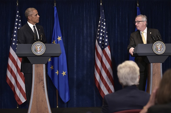 European Commission President Jean-Claude Juncker (R) speaks while looking at US President Barack Obama during a press conference for the joint press statements following a meeting on the sidelines of the NATO Summit at a hotel in Warsaw on July 8, 2016. The Polish capital hosts a two-day NATO summit, first time that it hosts a top-level meeting of the Western military alliance since it joined in 1999. / AFP / MANDEL NGAN (Photo credit should read MANDEL NGAN/AFP/Getty Images)