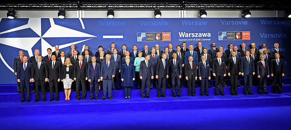 German Chancellor Angela Merkel (2nd row C), Poland's President Andrzej Duda (Bottom, C Left), NATO Secretary General Jens Stoltenberg (Bottom C) and US President Barack Obama (Bottom C Right) pose for a family photo besides other participants, during the NATO summit in Warsaw, Poland, on July 8, 2016. The Polish capital Warsaw hosts a two-day top-level NATO meeting, first time since Poland joined the alliance in 1999. / AFP / JANEK SKARZYNSKI (Photo credit should read JANEK SKARZYNSKI/AFP/Getty Images)