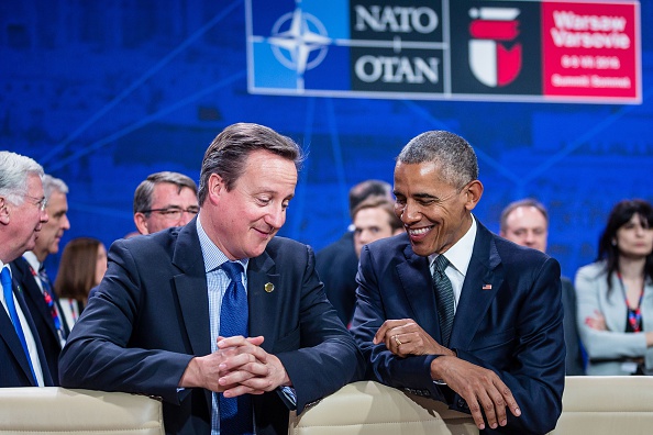 US President Barack Obama (R) and Great Britain's Prime Minister David Cameron (L) chat prior to the meeting of the heads of states of the North Atlantic Council (NAC), during the NATO summit in Warsaw, Poland. The Polish capital Warsaw hosts a two-day top-level NATO meeting, first time since Poland joined the alliance in 1999. / AFP / WOJTEK RADWANSKI (Photo credit should read WOJTEK RADWANSKI/AFP/Getty Images)