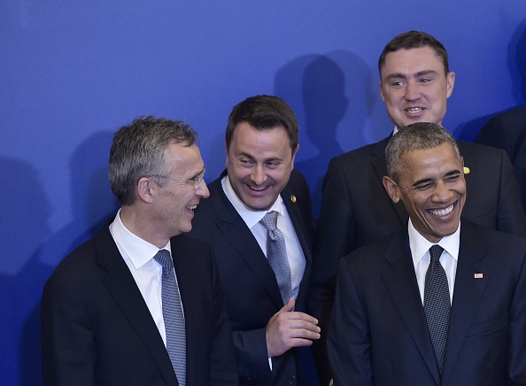 US President Barack Obama (R) and NATO Secretary General Jens Stoltenberg (L) smile while posing for a family photo ahead of a working dinner at the Presidential Palace during the NATO Summit in Warsaw on July 8, 2016. The Polish capital Warsaw hosts a two-day top-level NATO meeting, first time since Poland joined the alliance in 1999. / AFP / MANDEL NGAN (Photo credit should read MANDEL NGAN/AFP/Getty Images)