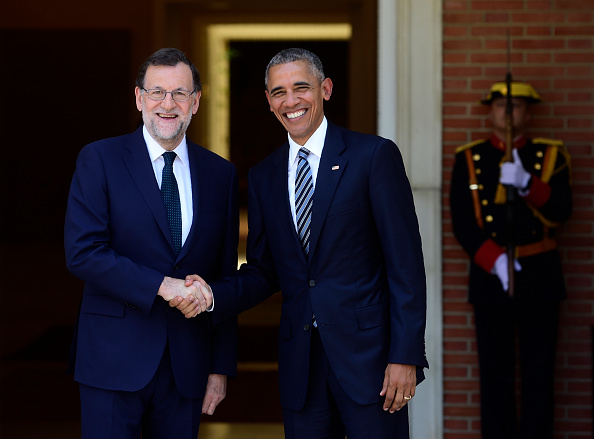 Spanish Prime Minister Mariano Rajoy (L) shakes hand with US president Barack Obama at Moncloa palace in Madrid on July 10, 2016. Obama said he will cut short a foreign trip and visit Dallas next week as the shooting rampage by the black army veteran, who said he wanted to kill white cops, triggered urgent calls to mend troubled race relations in the United States. / AFP / PIERRE-PHILIPPE MARCOU (Photo credit should read PIERRE-PHILIPPE MARCOU/AFP/Getty Images)