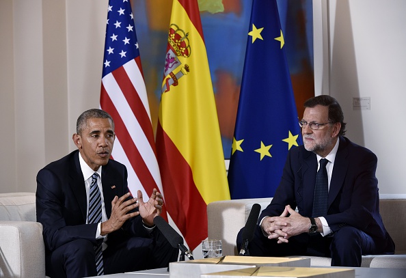 US President Barack Obama (L) speaks with Spain's interim prime minister Mariano Rajoy during a bilateral meeting at Moncloa palace in Madrid on July 10, 2016. Obama said he will cut short a foreign trip and visit Dallas next week as the shooting rampage by the black army veteran, who said he wanted to kill white cops, triggered urgent calls to mend troubled race relations in the United States. / AFP / Mandel Ngan (Photo credit should read MANDEL NGAN/AFP/Getty Images)