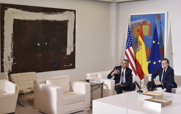 US President Barack Obama (L) speaks with Spain's interim prime minister Mariano Rajoy during a bilateral meeting at Moncloa palace in Madrid on July 10, 2016. Obama said he will cut short a foreign trip and visit Dallas next week as the shooting rampage by the black army veteran, who said he wanted to kill white cops, triggered urgent calls to mend troubled race relations in the United States. / AFP / Mandel Ngan (Photo credit should read MANDEL NGAN/AFP/Getty Images)