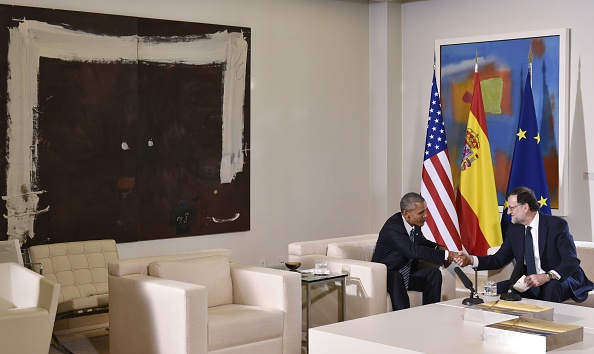 US President Barack Obama (L) shakes hands with Spain's interim prime minister Mariano Rajoy during a bilateral meeting at Moncloa palace in Madrid on July 10, 2016. Obama said he will cut short a foreign trip and visit Dallas next week as the shooting rampage by the black army veteran, who said he wanted to kill white cops, triggered urgent calls to mend troubled race relations in the United States. / AFP / Mandel Ngan (Photo credit should read MANDEL NGAN/AFP/Getty Images)