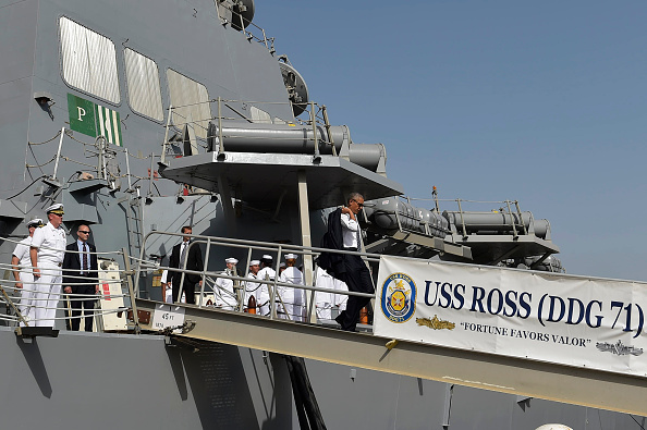US President Barack Obama (C) leaves the USS Ross Navy ship after a visit on board, at the Naval Station Rota, in Rota, southwestern Spain on July 10, 2016. Obama said he will cut short a foreign trip and visit Dallas next week as the shooting rampage by the black army veteran, who said he wanted to kill white cops, triggered urgent calls to mend troubled race relations in the United States. / AFP / MANDEL NGAN (Photo credit should read MANDEL NGAN/AFP/Getty Images)
