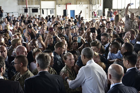 US President Barack Obama (3rdR) greets attendees after speaking to service members at the Naval Station Rota, in Rota, southwestern Spain on July 10, 2016. Obama said he will cut short a foreign trip and visit Dallas next week as the shooting rampage by the black army veteran, who said he wanted to kill white cops, triggered urgent calls to mend troubled race relations in the United States. / AFP / MANDEL NGAN (Photo credit should read MANDEL NGAN/AFP/Getty Images)