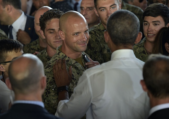 US President Barack Obama (R) greets attendees after speaking to service members at the Naval Station Rota, in Rota, southwestern Spain on July 10, 2016. Obama said he will cut short a foreign trip and visit Dallas next week as the shooting rampage by the black army veteran, who said he wanted to kill white cops, triggered urgent calls to mend troubled race relations in the United States. / AFP / Mandel NGAN (Photo credit should read MANDEL NGAN/AFP/Getty Images)