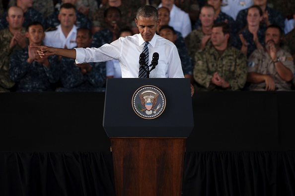 US president Barack Obama gestures as he speaks to service members at the Naval Station Rota, in Rota, southwestern Spain on July 10, 2016 Obama said he will cut short a foreign trip and visit Dallas next week as the shooting rampage by the black army veteran, who said he wanted to kill white cops, triggered urgent calls to mend troubled race relations in the United States. / AFP / JORGE GUERRERO (Photo credit should read JORGE GUERRERO/AFP/Getty Images)