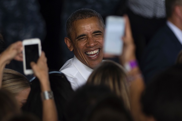 US president Barack Obama laughs after speaking to service members at the Naval Station Rota, in Rota, southwestern Spain on July 10, 2016 Obama said he will cut short a foreign trip and visit Dallas next week as the shooting rampage by the black army veteran, who said he wanted to kill white cops, triggered urgent calls to mend troubled race relations in the United States. / AFP / JORGE GUERRERO (Photo credit should read JORGE GUERRERO/AFP/Getty Images)