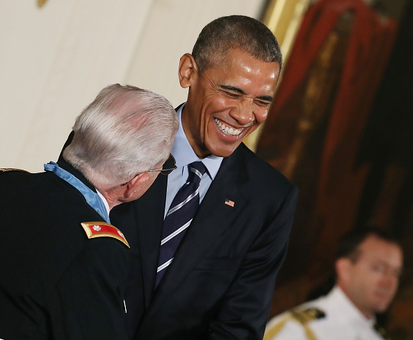 WASHINGTON, DC - JULY 18: U.S. President Barack Obama shares a laugh with retired Army Lt. Col. Charles Kettles, after presenting him with the Medal Of Honor during a ceremony in the East Room at the White House July 18, 2016 in Washington, DC. Kettles who was a UH-1D Huey helicopter pilot during the Vietnam War displayed extraordinary heroism, and is credited with saving the lives of 40 soldiers and four of his own crew members. (Photo by Mark Wilson/Getty Images)