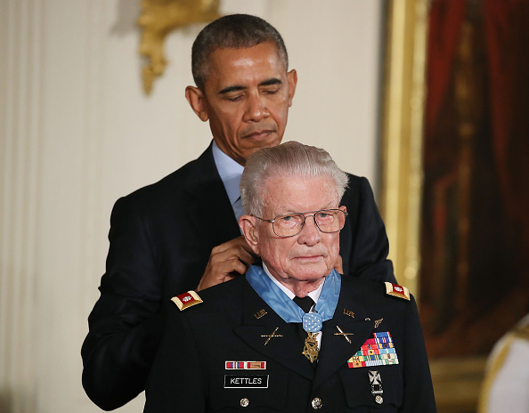 WASHINGTON, DC - JULY 18: U.S. President Barack Obama presents the Medal of Honor to retired Army Lt. Col. Charles Kettles, during a ceremony in the East Room at the White House July 18, 2016 in Washington, DC. Kettles who was a UH-1D Huey helicopter pilot during the Vietnam War displayed extraordinary heroism, and is credited with saving the lives of 40 soldiers and four of his own crew members. (Photo by Mark Wilson/Getty Images)