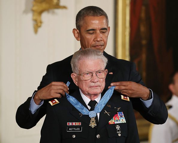 WASHINGTON, DC - JULY 18: U.S. President Barack Obama presents the Medal of Honor to retired Army Lt. Col. Charles Kettles, during a ceremony in the East Room at the White House July 18, 2016 in Washington, DC. Kettles who was a UH-1D Huey helicopter pilot during the Vietnam War displayed extraordinary heroism, and is credited with saving the lives of 40 soldiers and four of his own crew members. (Photo by Mark Wilson/Getty Images)